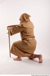 JOEL_ADAMSON MONK KNEELING POSE WITH SWORD
